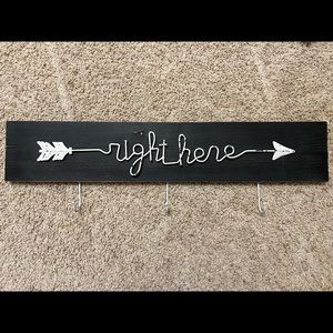 Wooden sign with hooks